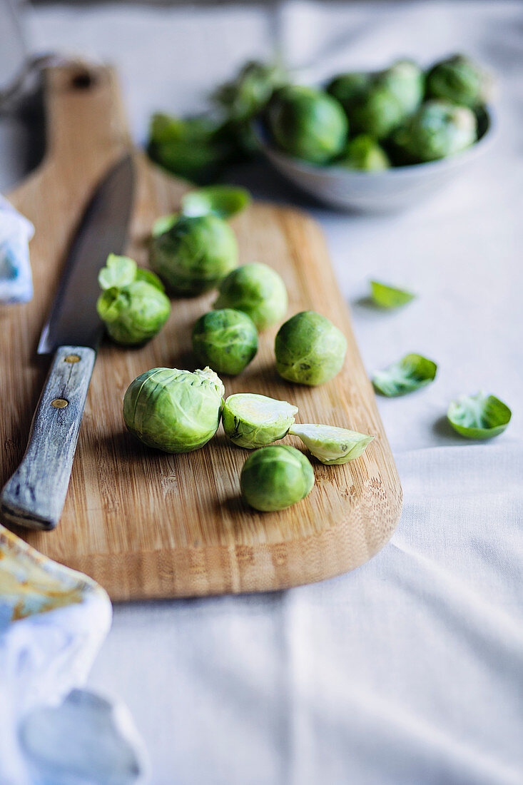 Brussels sprouts on wooden cutting board