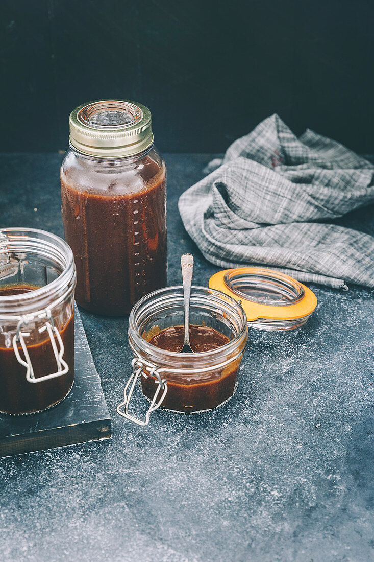 Date and tamarind chutney in glass jars