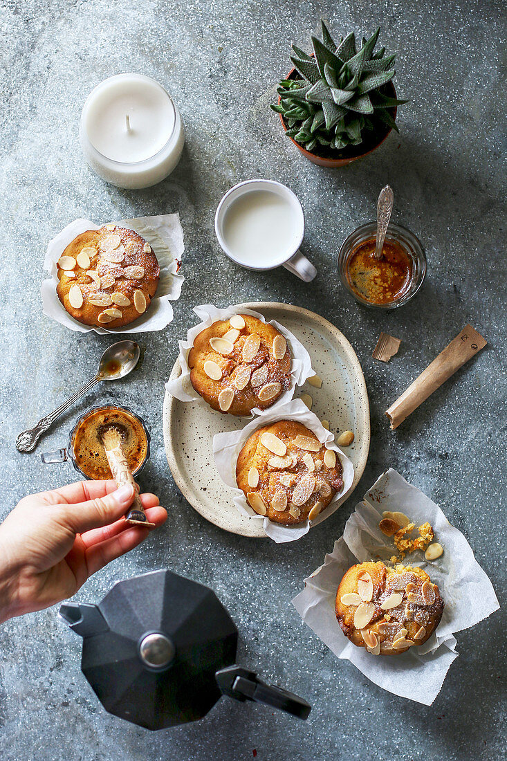 Breakfast with almond muffins and coffee on the table