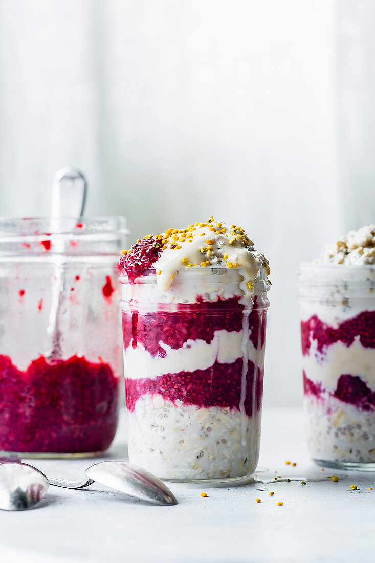 Creamy vegan overnight oats with berry chia jam and bee pollen