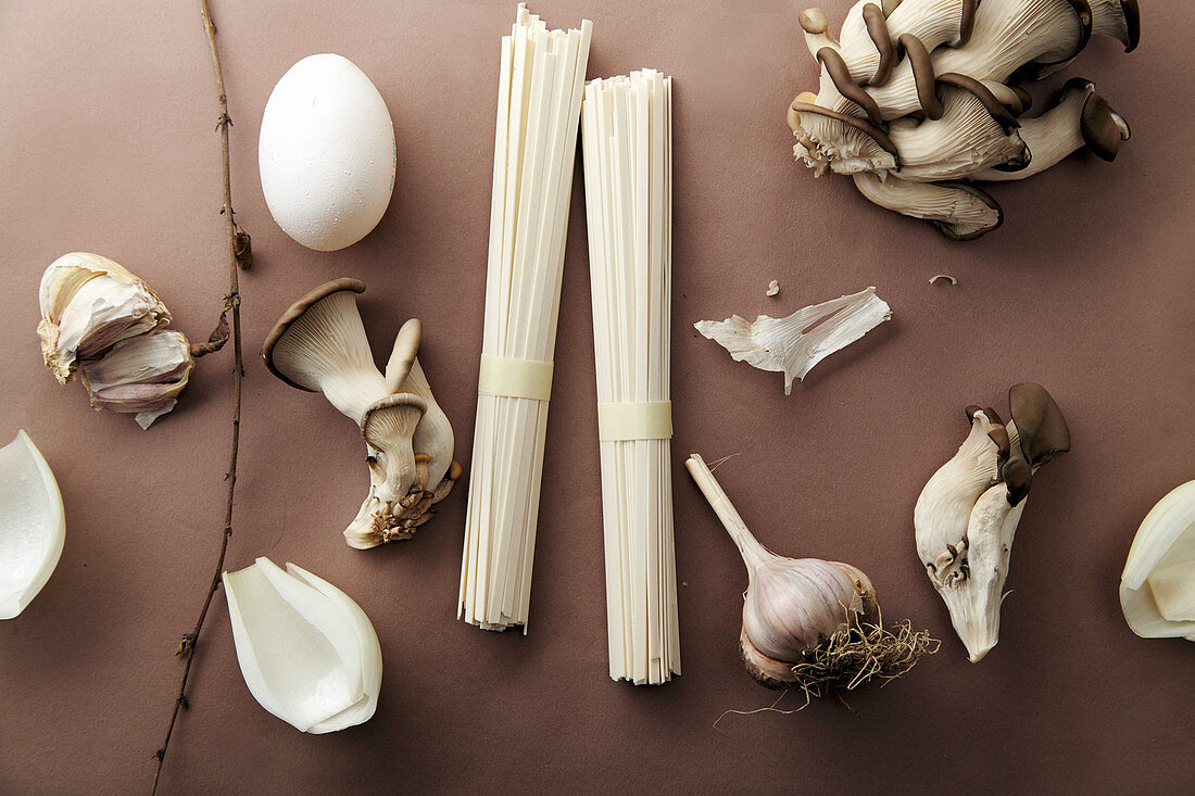 Asian cuisine ingredients on brown background