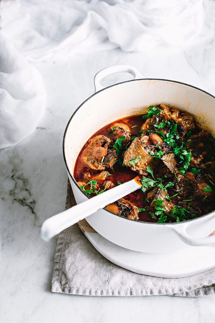 Oxtail casserole on a rustic kitchen table