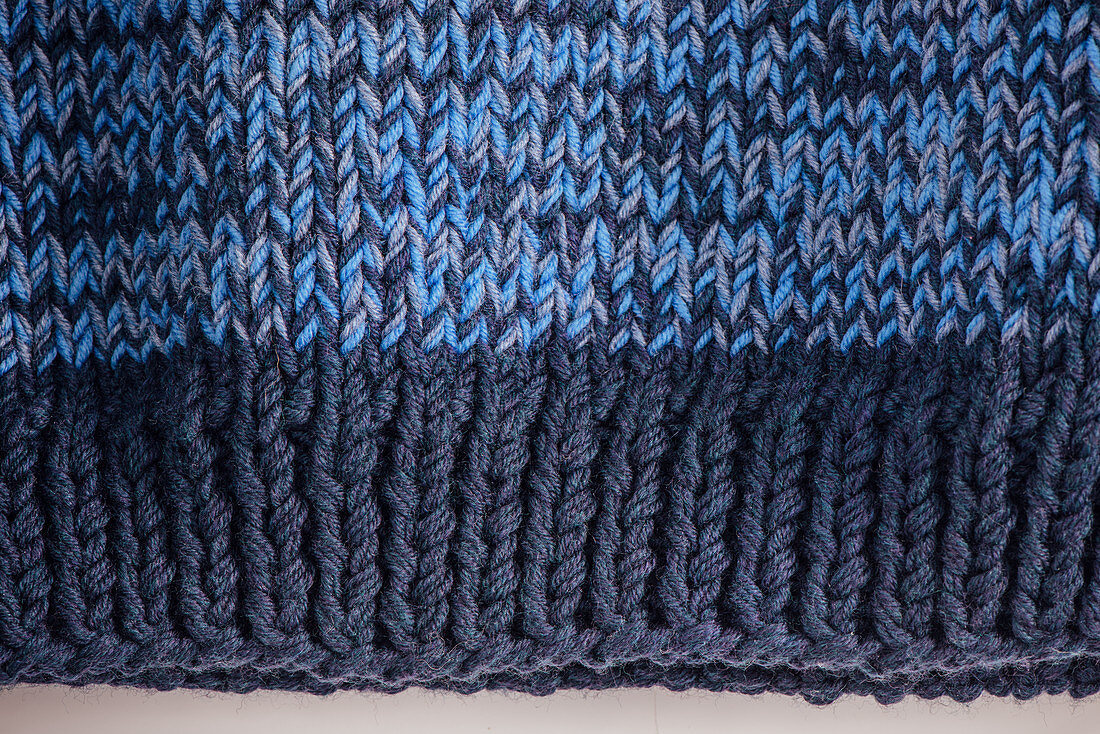 A hand-knitted men's jumper (detail of hem)