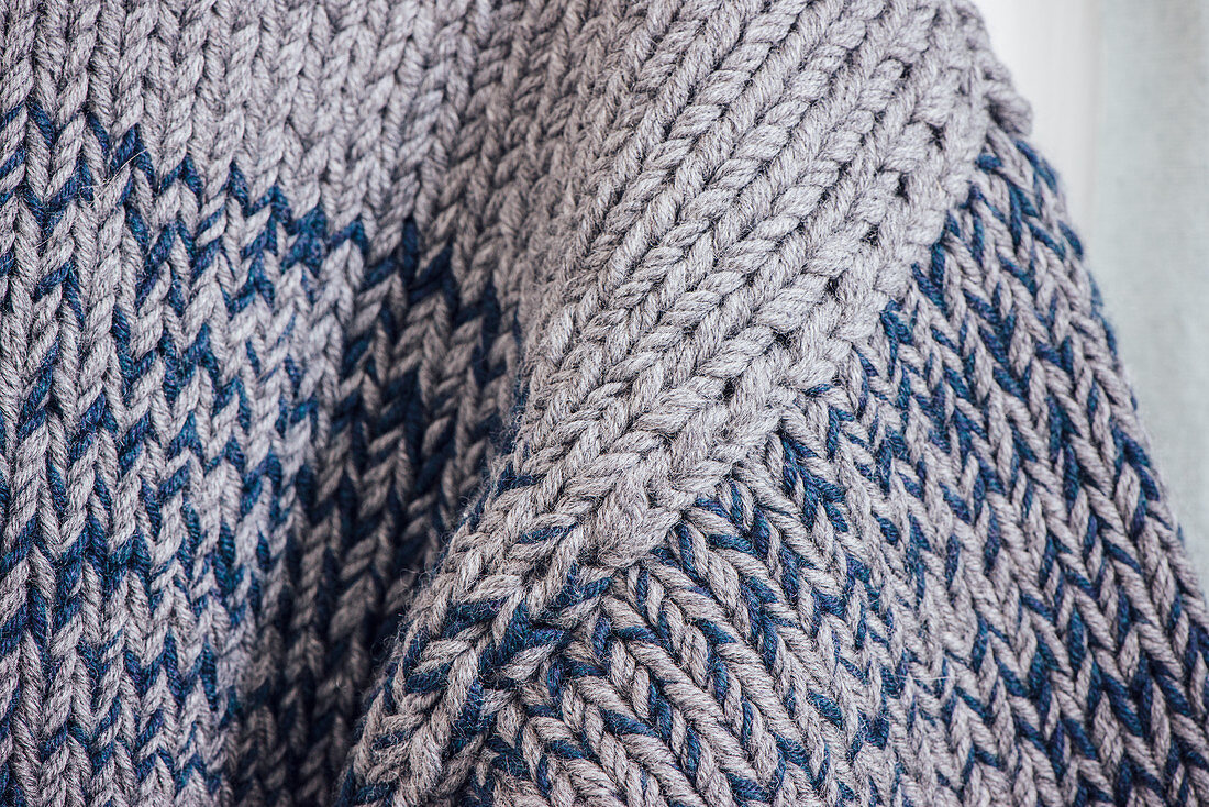 A hand-knitted men's jumper (detail of sleeve)