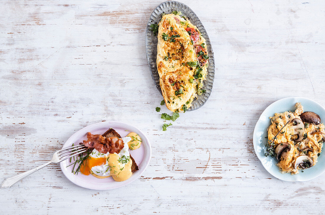 Eggs Benedict, vegetable omelette and scrambled eggs with mushrooms