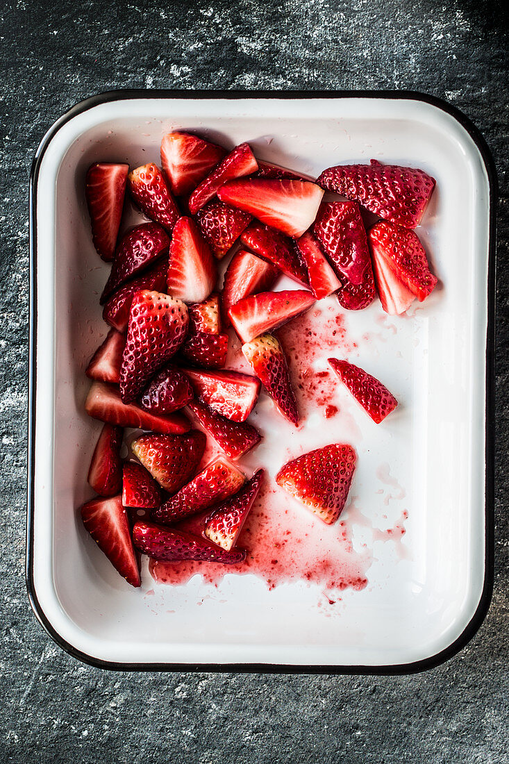 Sugared strawberries on an enamel dish