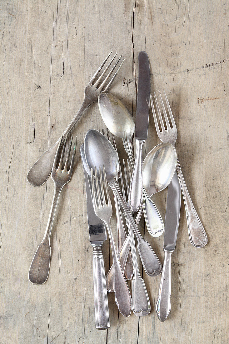 Vintage cutlery on a wooden surface
