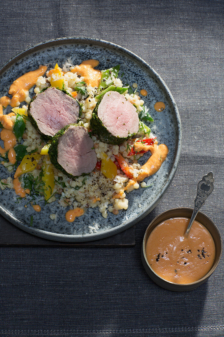 Veal medallions with a herb coating with rouille and pepper fregola