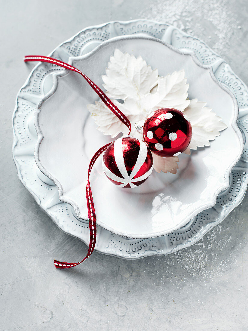A place setting with Christmas baubles