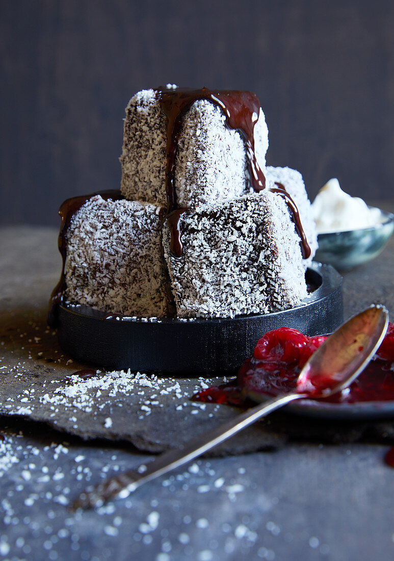 Dirty lamingtons with chocolate sauce and raspberry puree