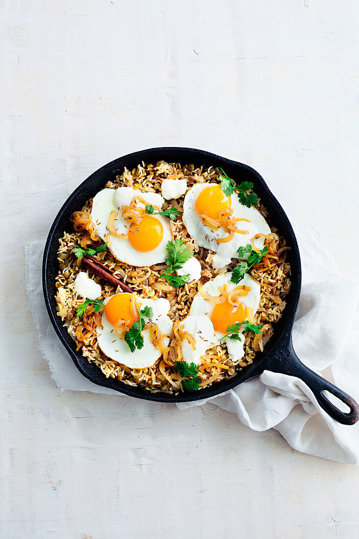 Lebanese caramelised-onion pilaf with fried eggs