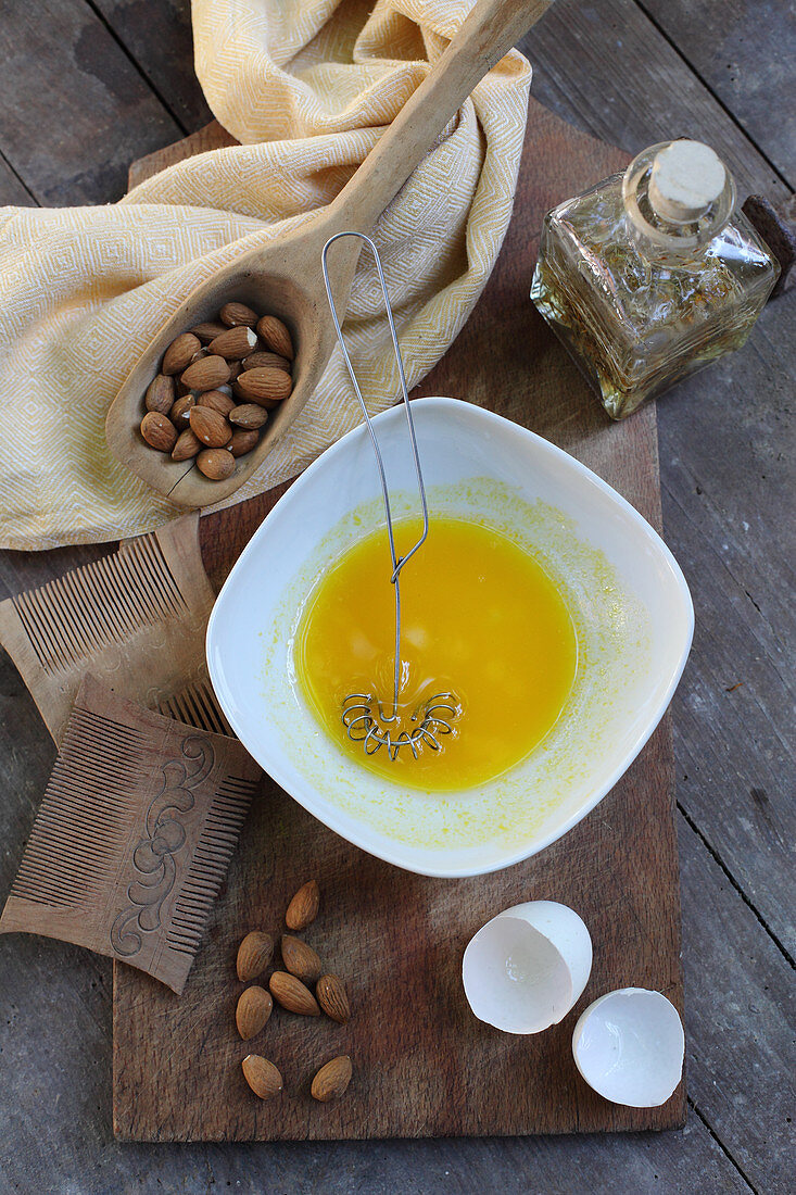 A nourishing hair mask made from almond oil, arnica flowers and egg yolks for treating dandruff