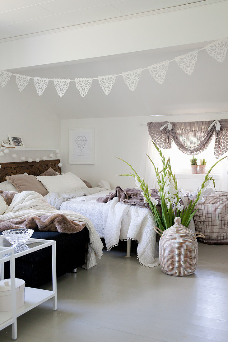 Bohemian-style bedroom with sloping ceiling