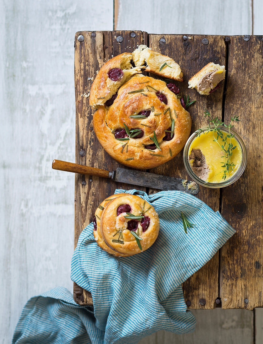 Brioche slices with sour cherries, and rosemary with chicken pie