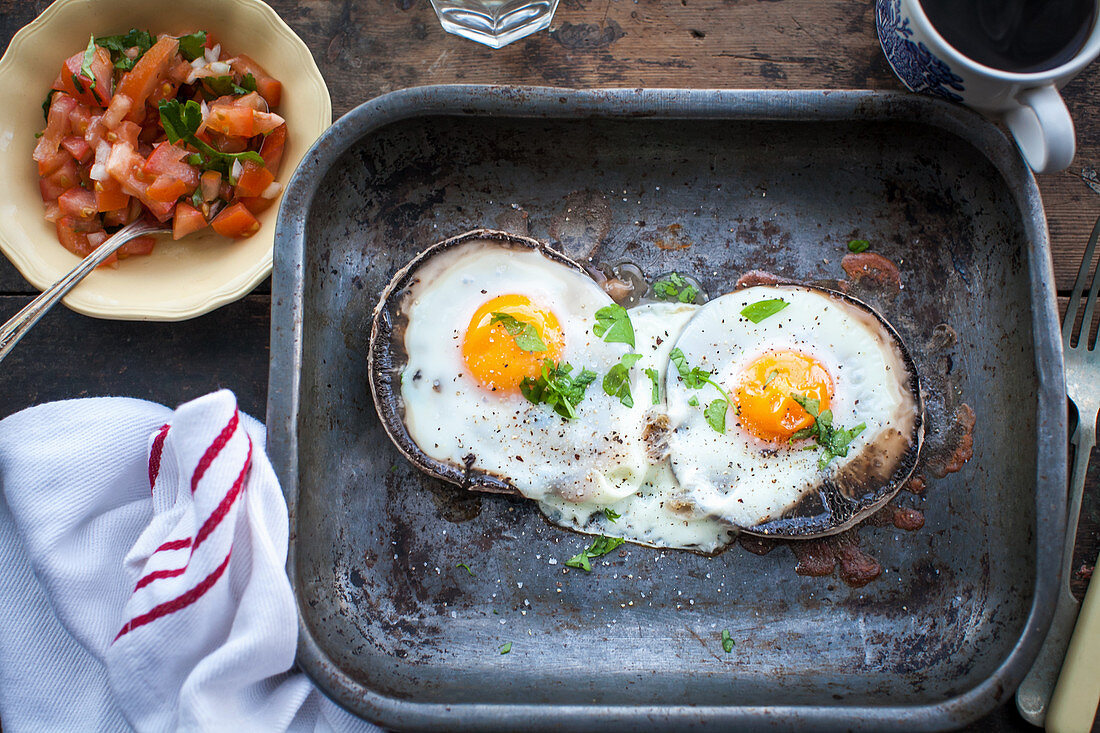 Brunch of baked eggs on portobello mushrooms