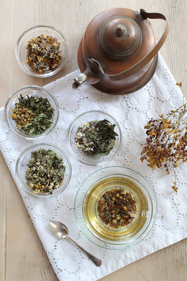 Various herbal teas with woman