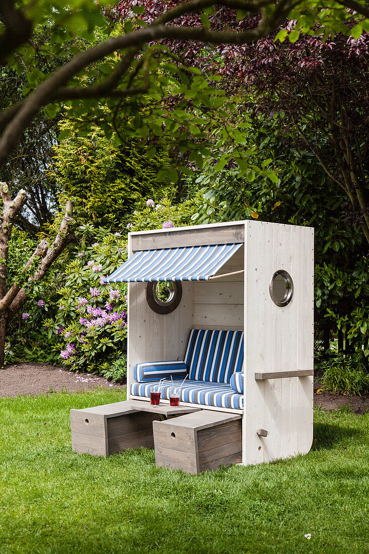 DIY wooden beach chair with blue-striped cushions