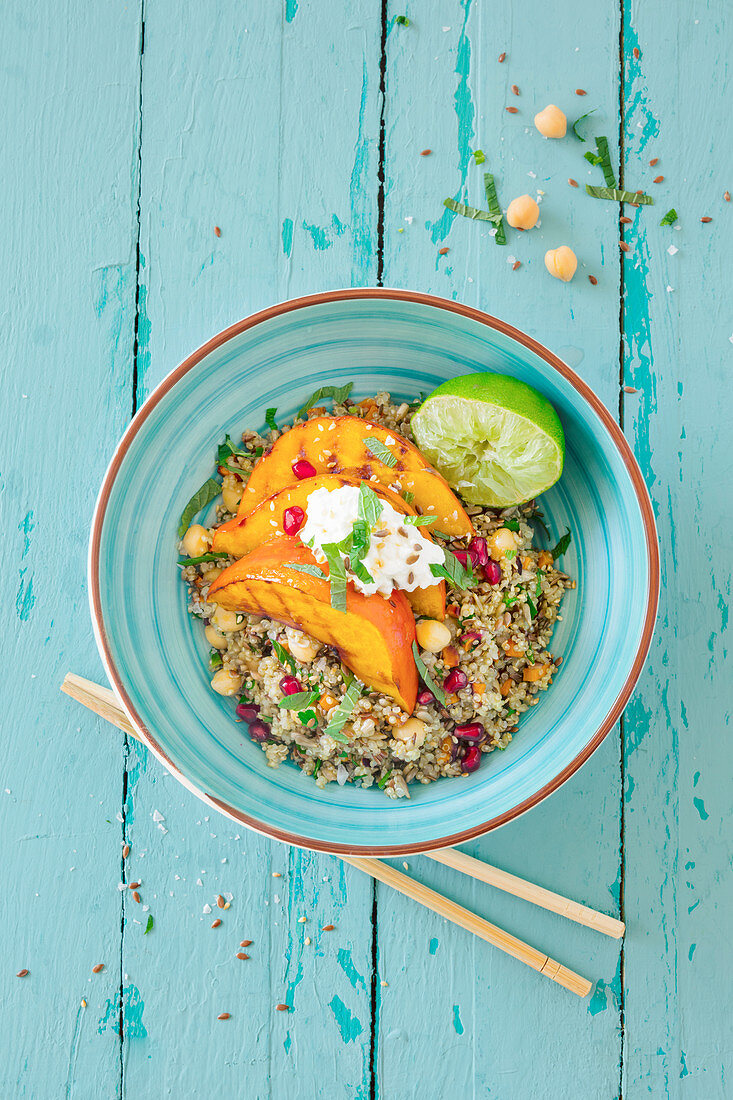 Buddha bowl with quinoa and chickpea salad, grilled pumpkin and cottage cheese