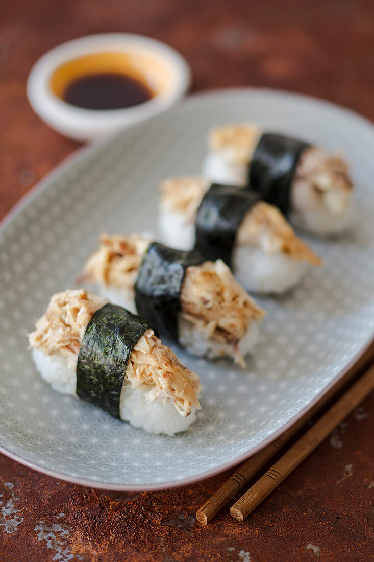 Nigiri sushi with a sweet and sour chicken salad