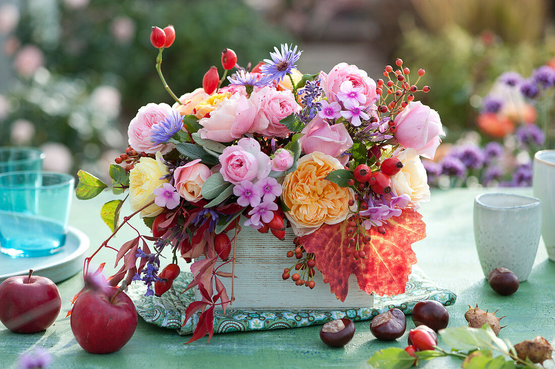 Colorful Autumn Arrangement With Roses, Rose Hips And Phlox