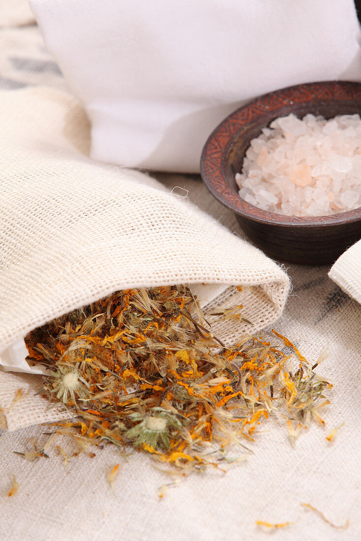 The ingredients for a salt wrap with Arnica flowers
