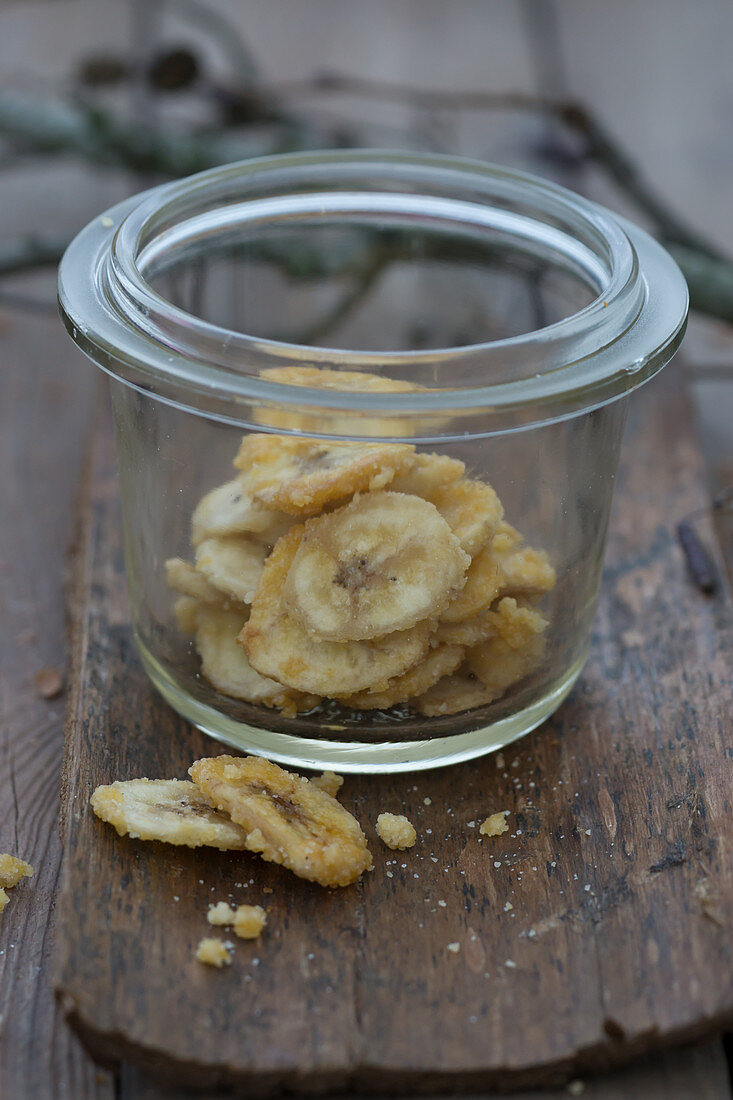 Homemade sweet banana chips in a mason jar