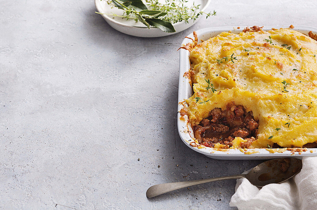 Italian sausage pie with cheesy polenta topping