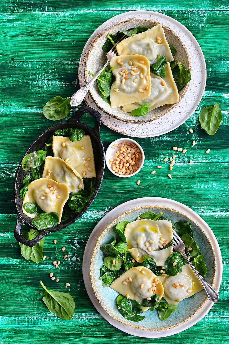 Ravioli with spinach, served with pini nuts