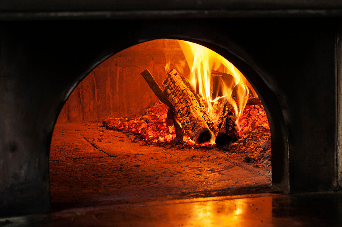 Fire burning in a pizza oven