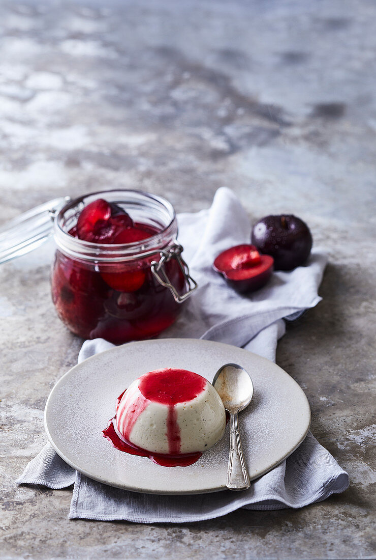 Yogurt panna cotta with vanilla and poached plums