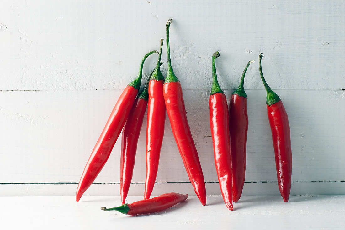 Fresh Red hot chili peppers on white background