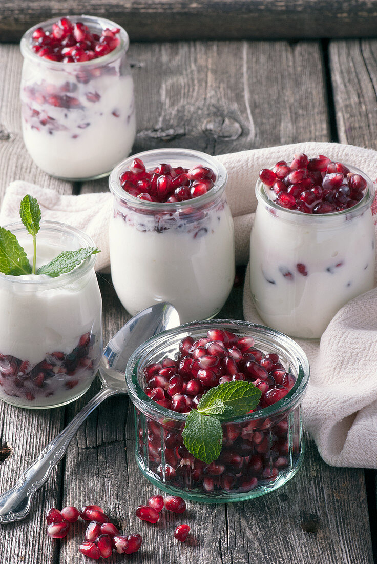 Mini yogurt with pomegranate seeds