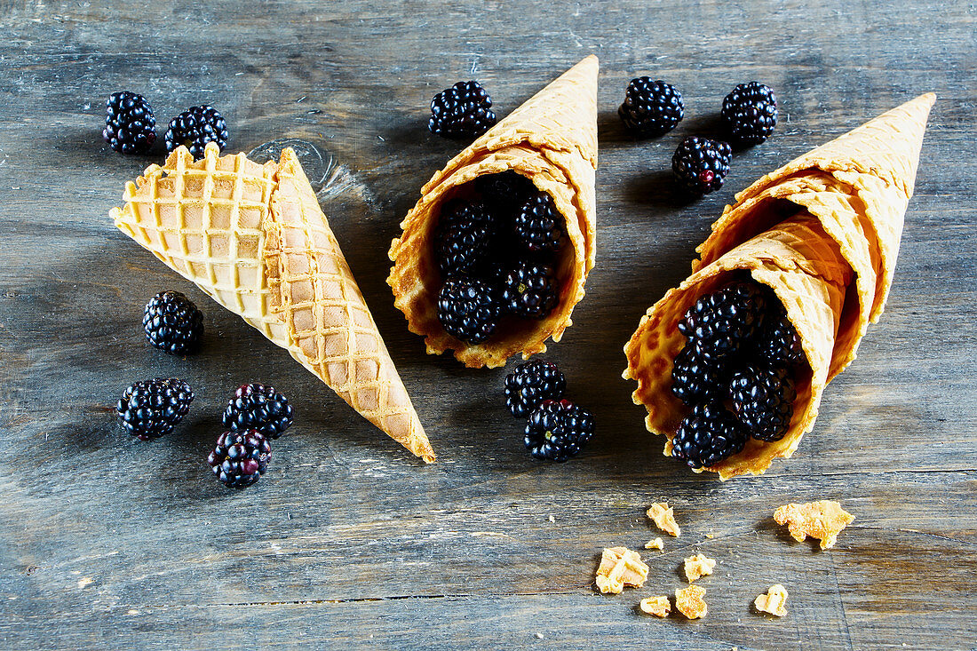 Fresh blackberries in ice cream cones