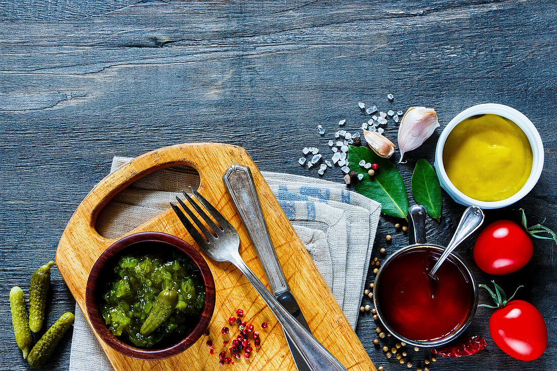 Still life with three different sauces and ingredients (top view)