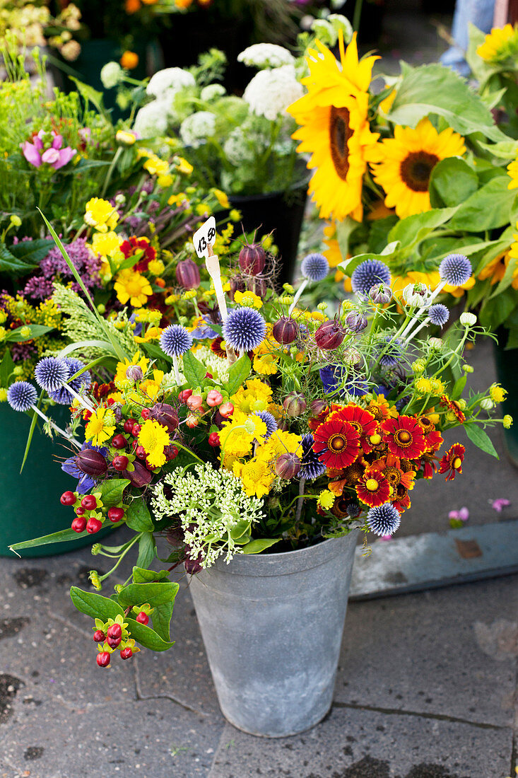 Summer bouquet with globe thistles (echinops) and Helenium