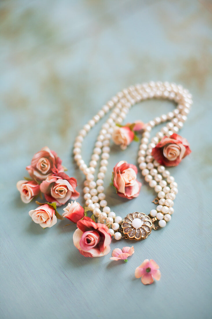 Roses and elegant pearl necklace