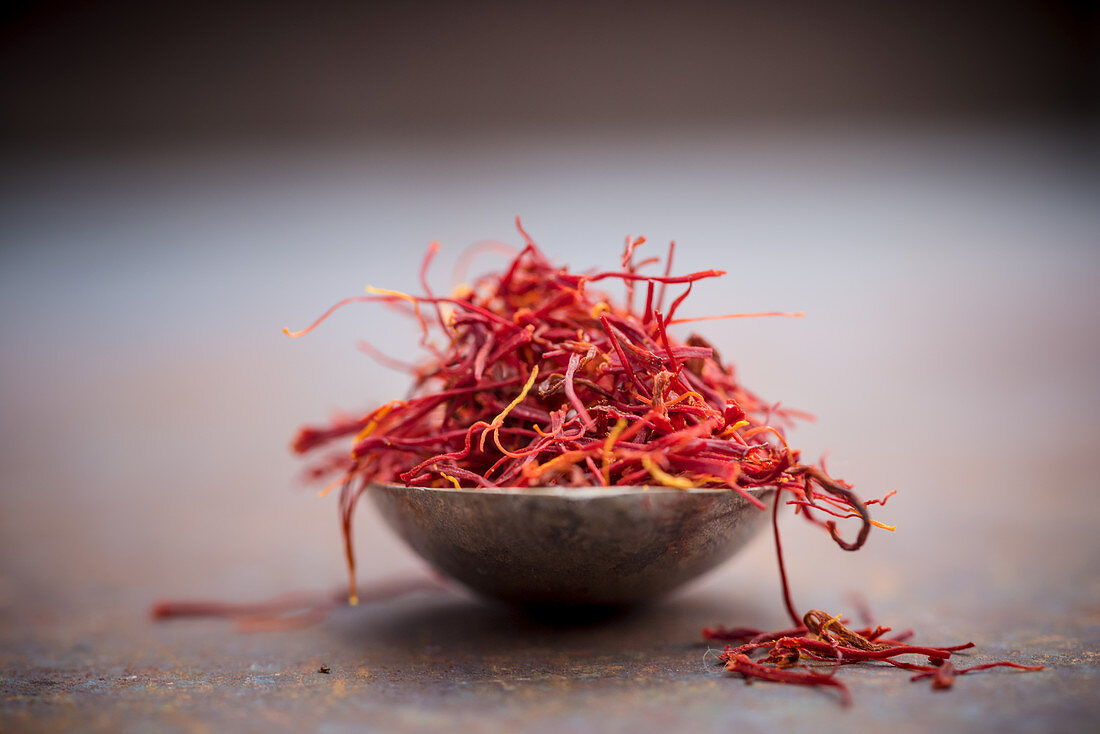 Saffron threads in a metal bowl