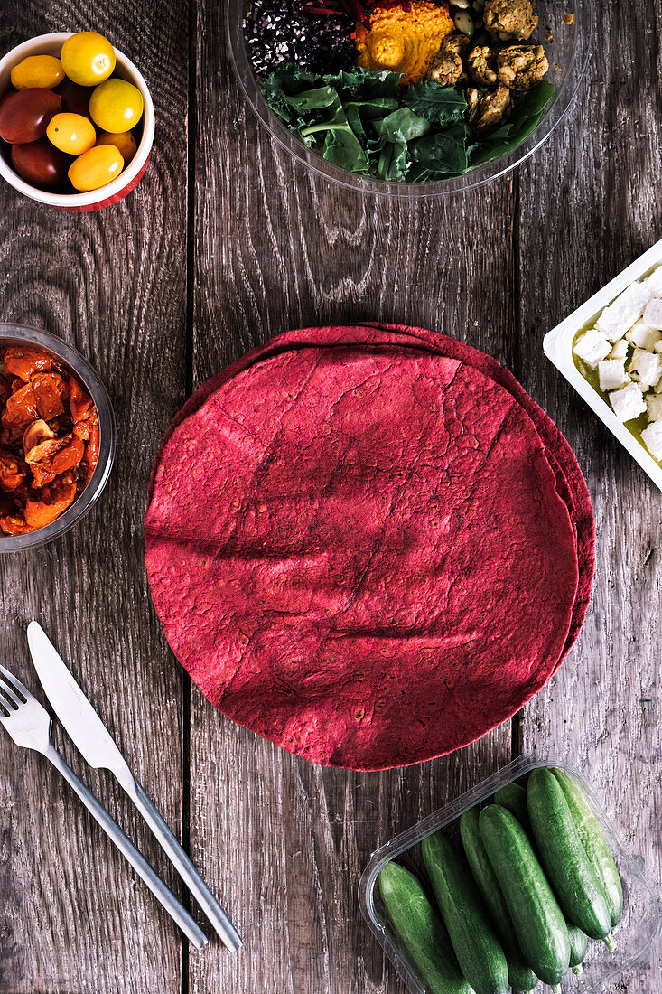 Beetroot wraps with semi-dried tomatoes, greek feta, cucumbers, cherry tomatoes and salad