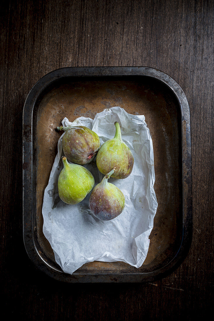 Four figs in a metal tray