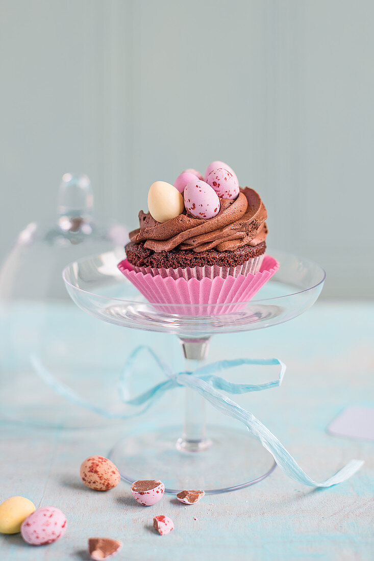 Easter chocolate cupcake on a glass stand