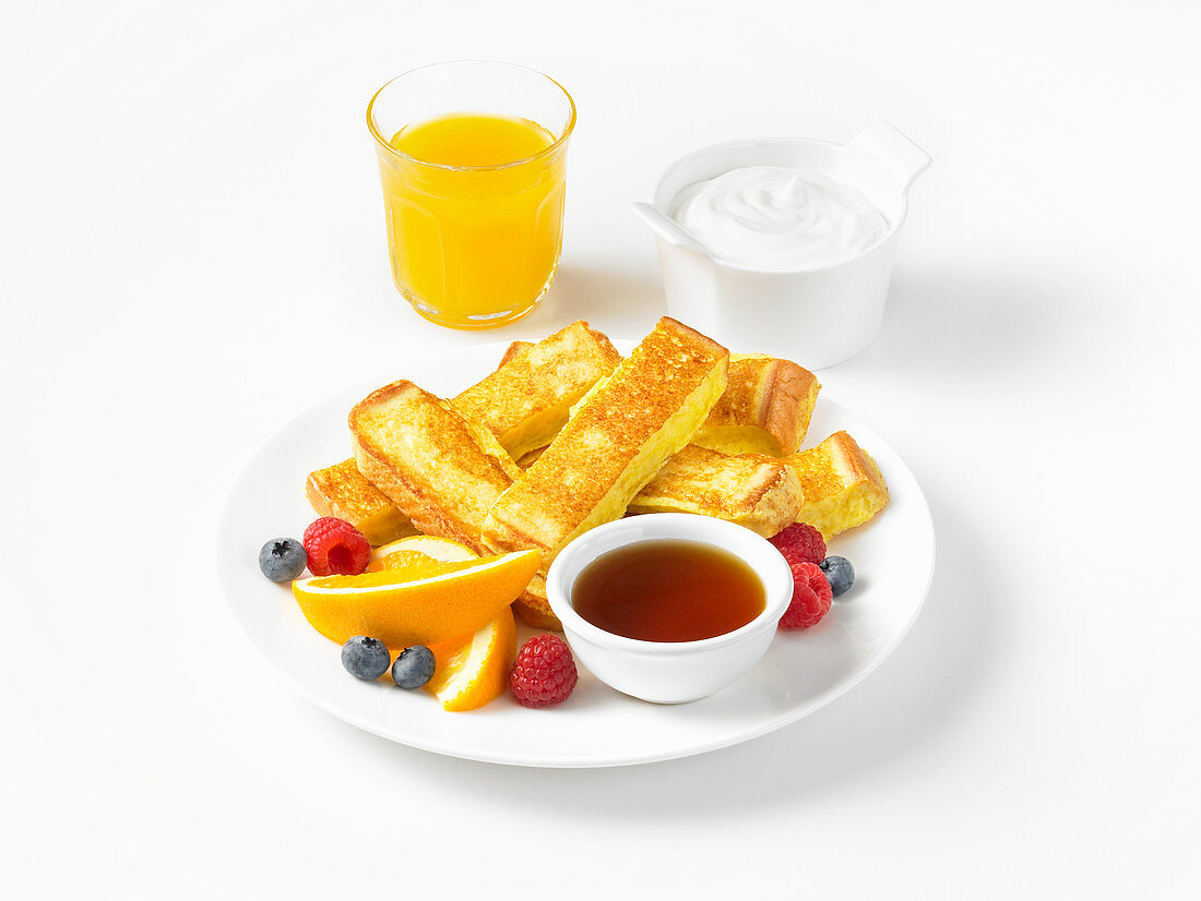 French Toast Stick with berries and marple syrup