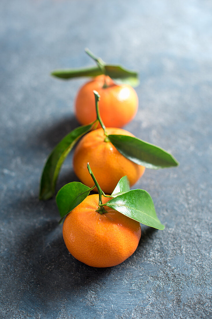 Mandarins on a stone surface, close up
