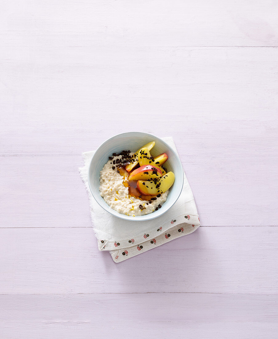 Orange oatmeal with apples and coffee beans