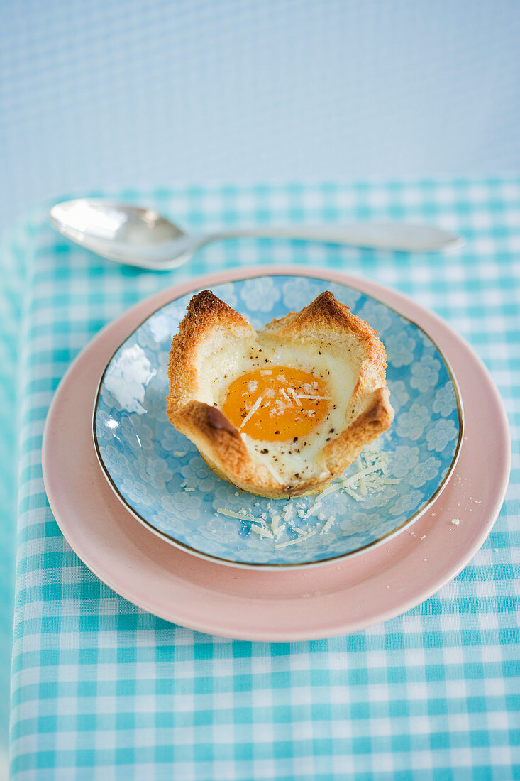 An egg in a toast bowl for breakfast