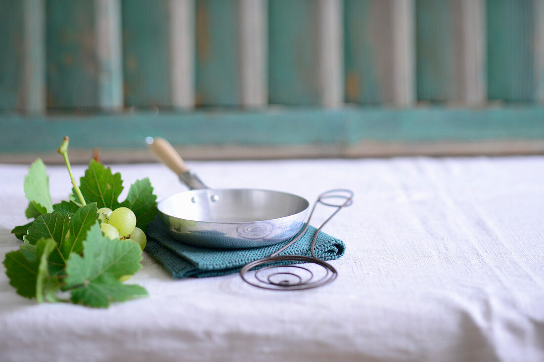 Wine grapes, and empty pan and a spatula