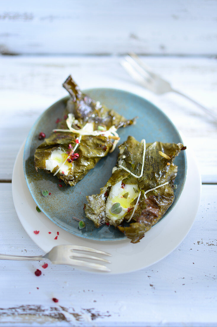 Baked feta cheese in vine leaves