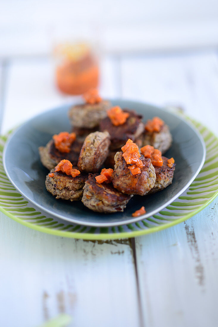 Bean balls with a pepper sauce