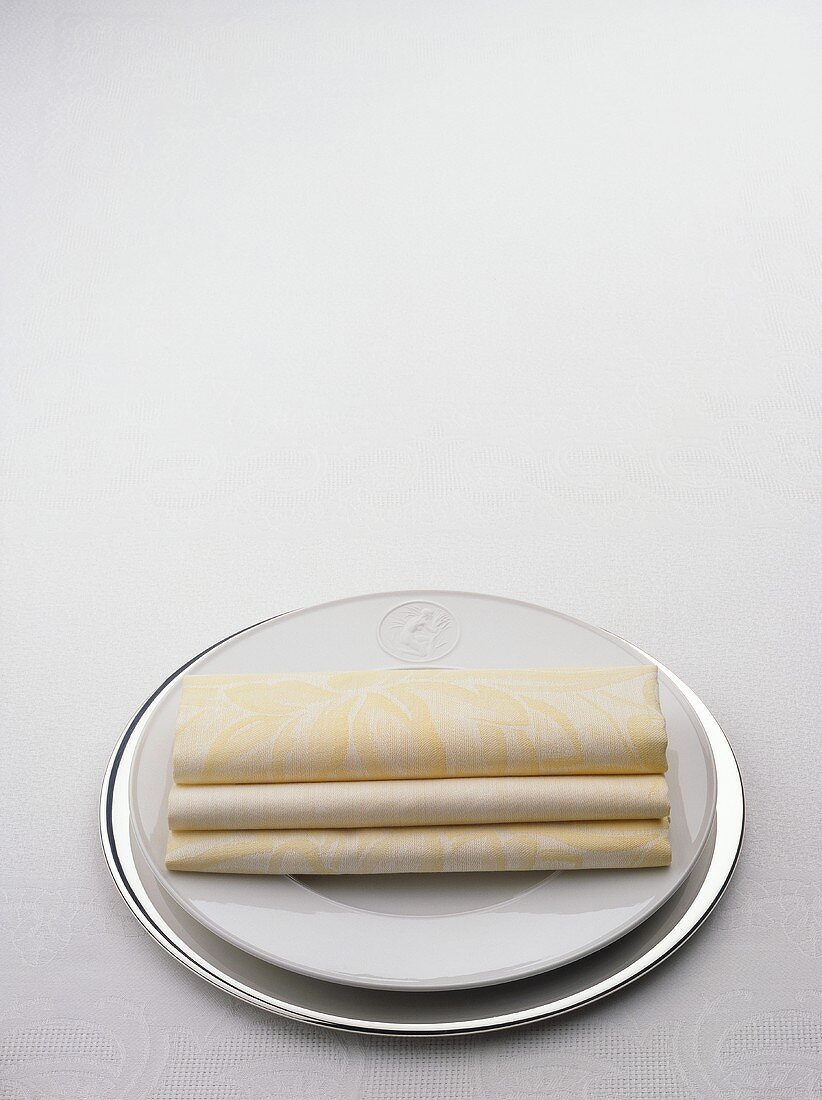 Folded Napkins and Plates for Place Setting