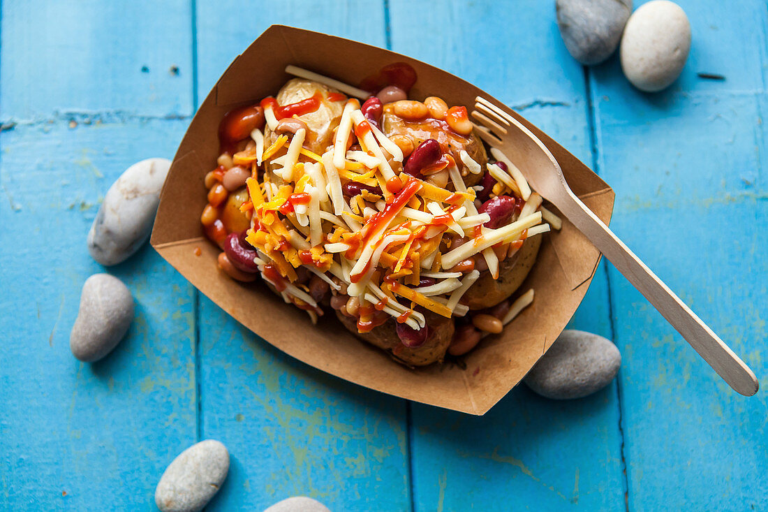 Fried potatoes with baked beans and cheese