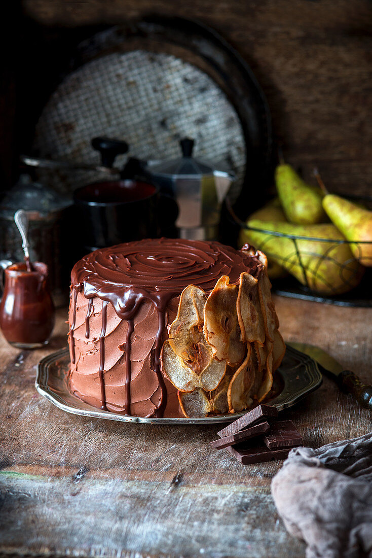 Chocolate cake with blue cheese baked cheesecake layer and pears